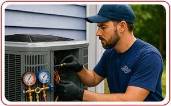 HVAC technician repairing AC unit in residential neighborhood Central Kentucky