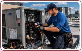 Technician repairing commercial HVAC on  business rooftop Central Kentucky