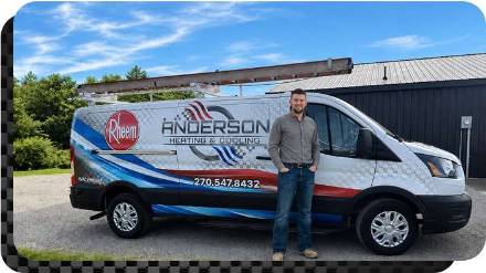 Jake Anderson standing in from of his Anderson Heating & Cooling van